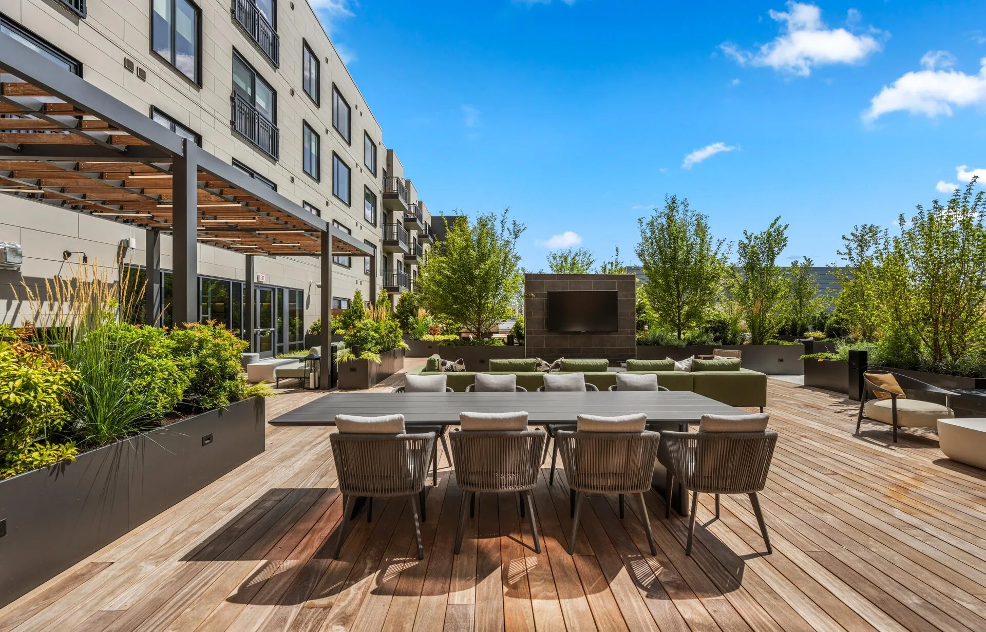 Enjoy friendly competition and socializing at our rooftop deck's bag toss area, complete with communal seating.