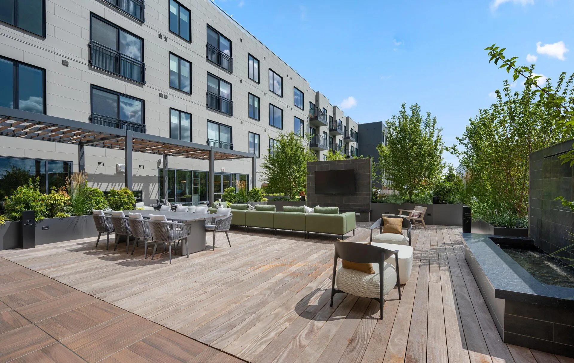 A welcoming entrance view highlighting the inviting corner of Alder' at Allston Yard.