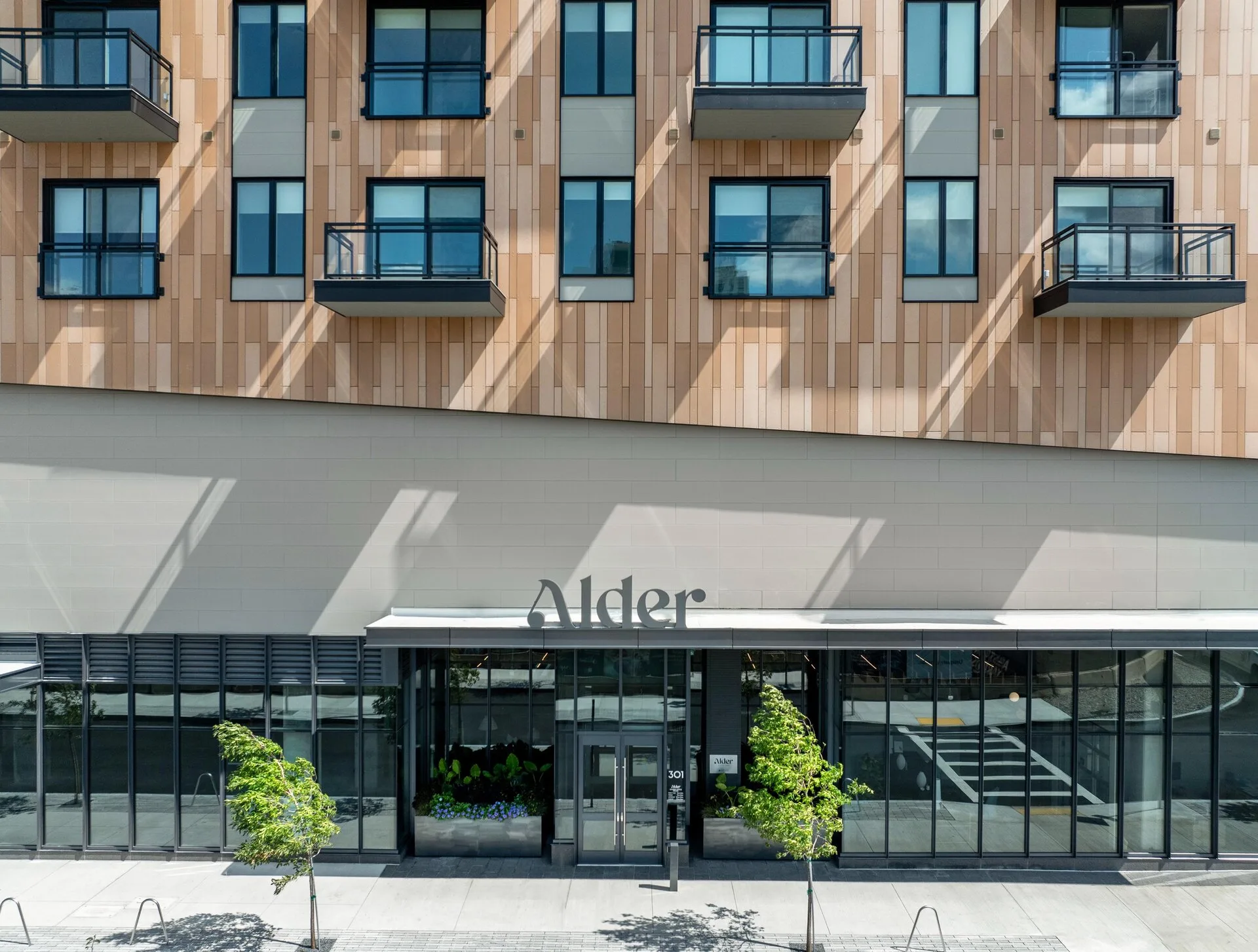 Alder_EXT_Features_EntranceWLandmarkSign_Gunnar_August2024-jpg.webp