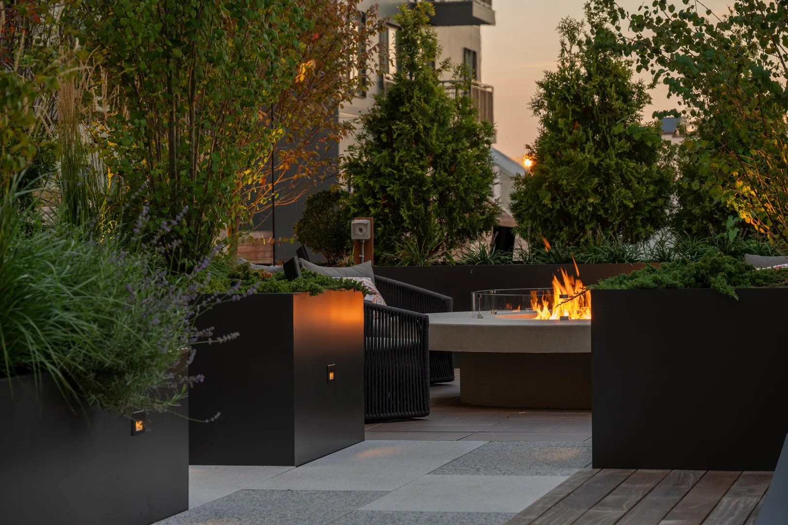 As the sun sets, the firepit nook provides the perfect space for cozy gatherings and evening relaxation.